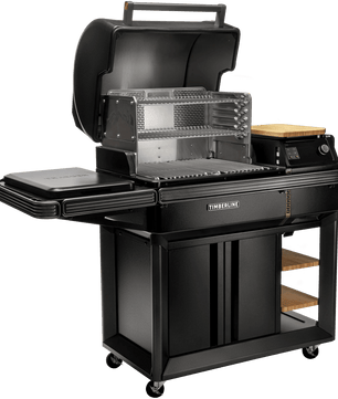 Black barbecue grill with multiple cooking surfaces on a white background