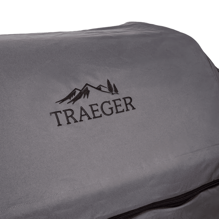Gray Traeger grill cover with logo on a white background
