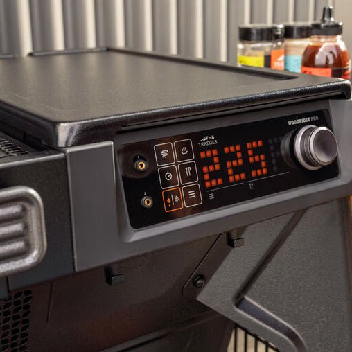Portable grill with digital temperature display on a stand